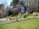 Stately Home Nestled Atop Acres Rolling Flowing Pastures